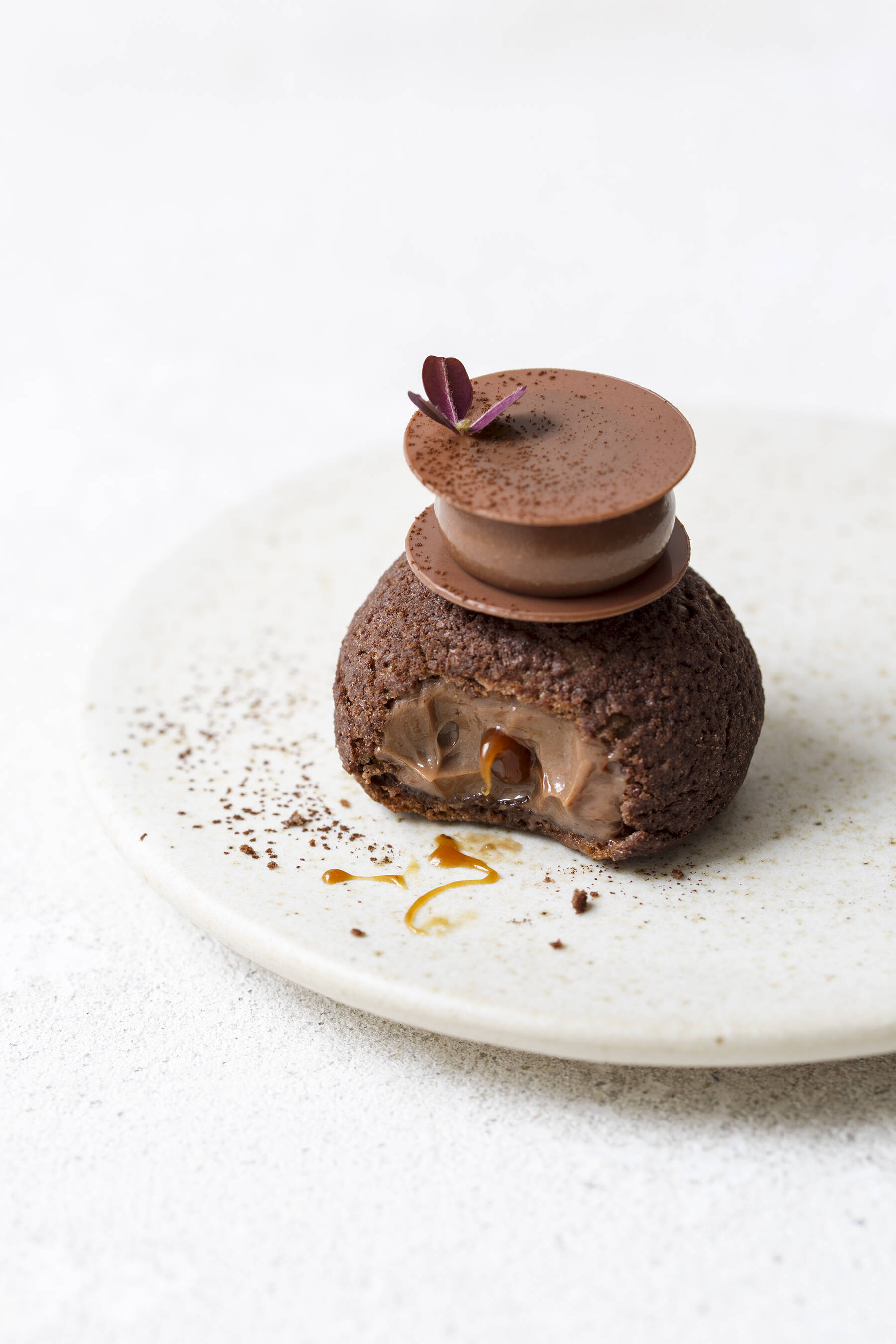 Chocolate choux au craquelin with coffee and lemon