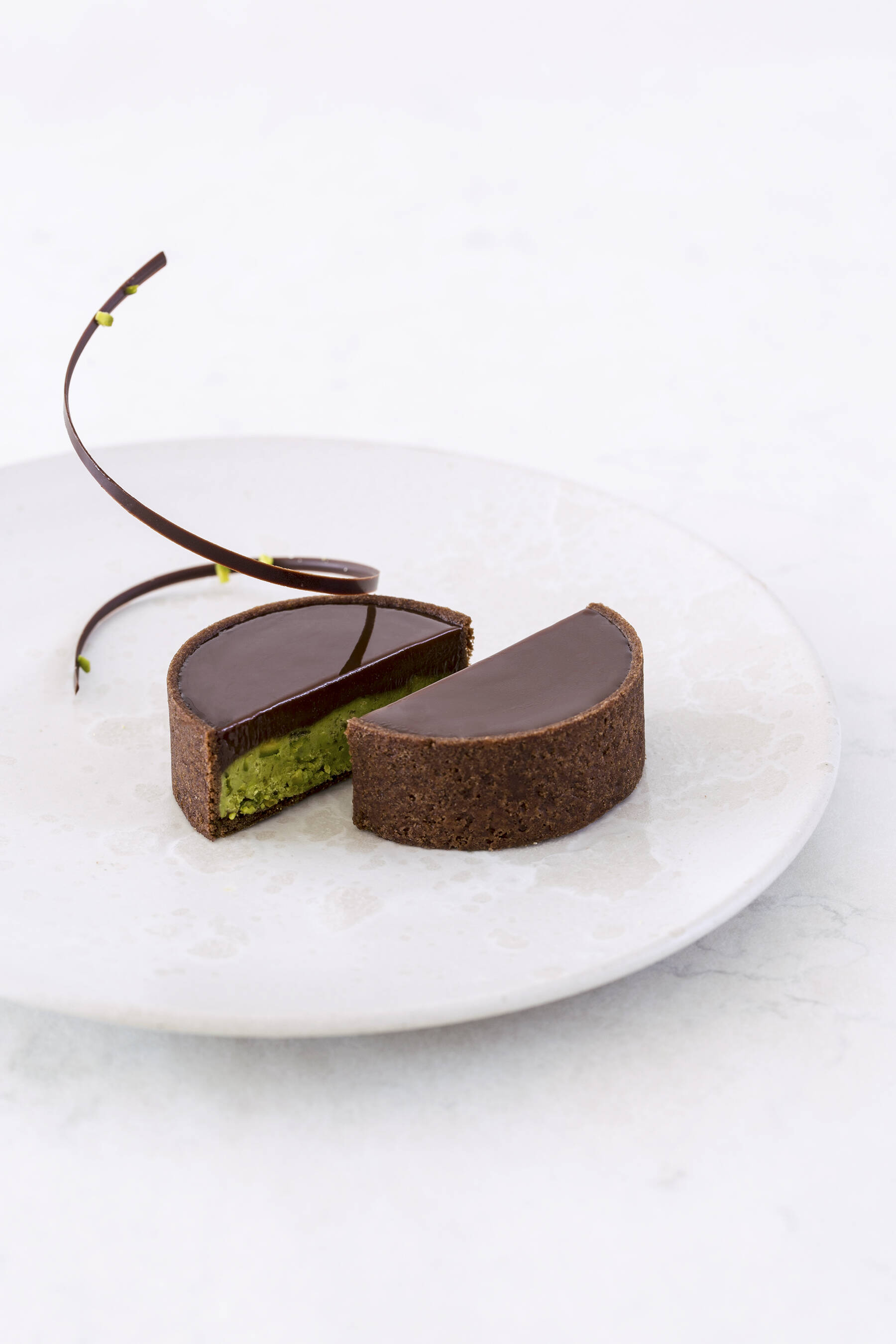 Small pistachio chocolate tarts