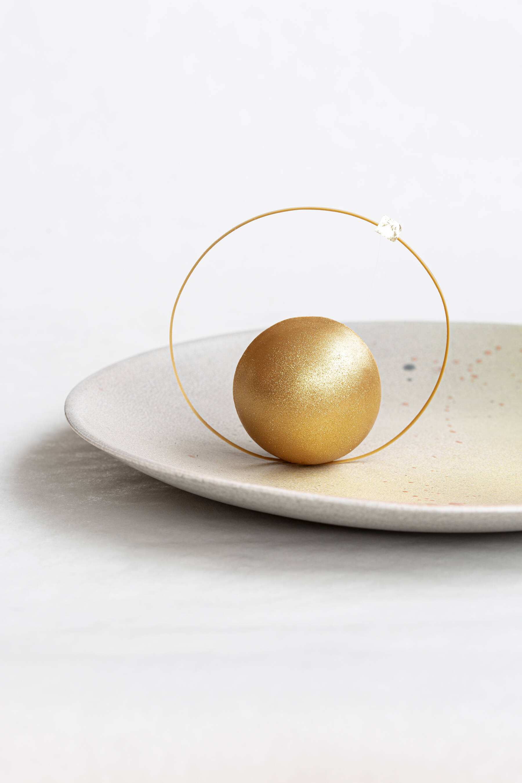 Golden planet with passion fruit and caramel