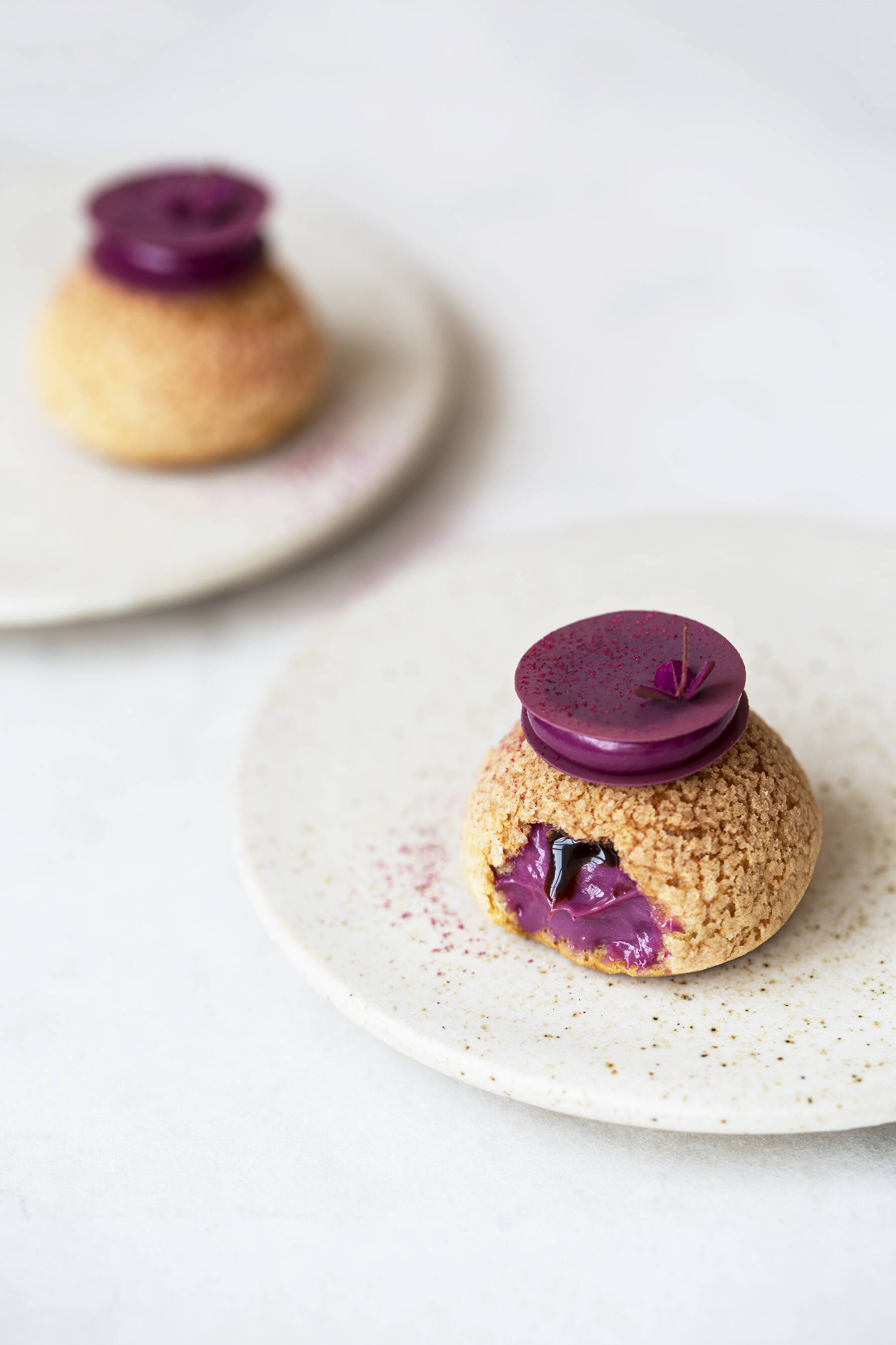 Choux au craquelin with blackcurrant and liquorice