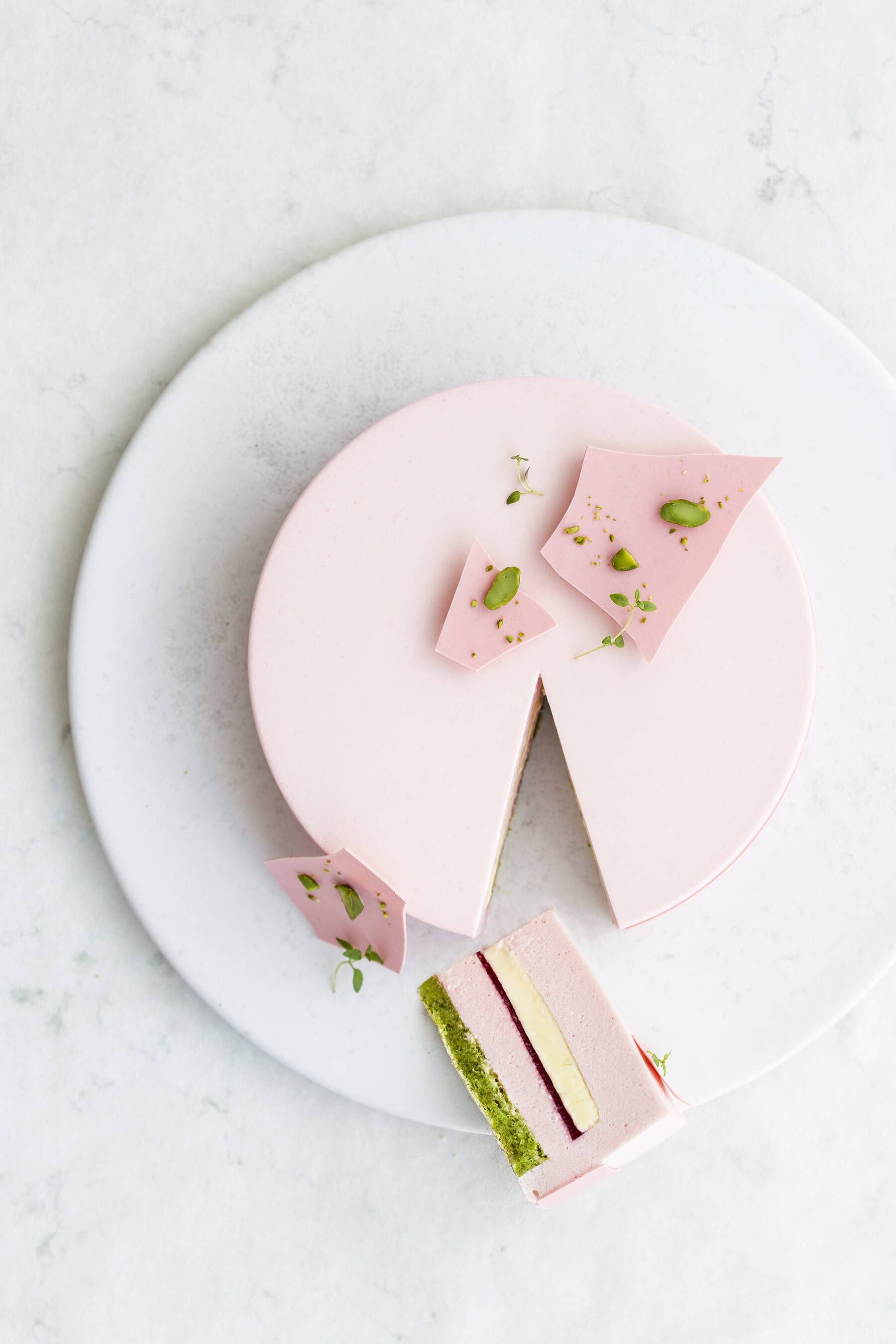 Raspberry cake with thyme, pistachio and lime